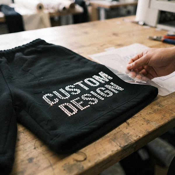 Rhinestone CUSTOM DESIGN lettering on the leg of sweat shorts