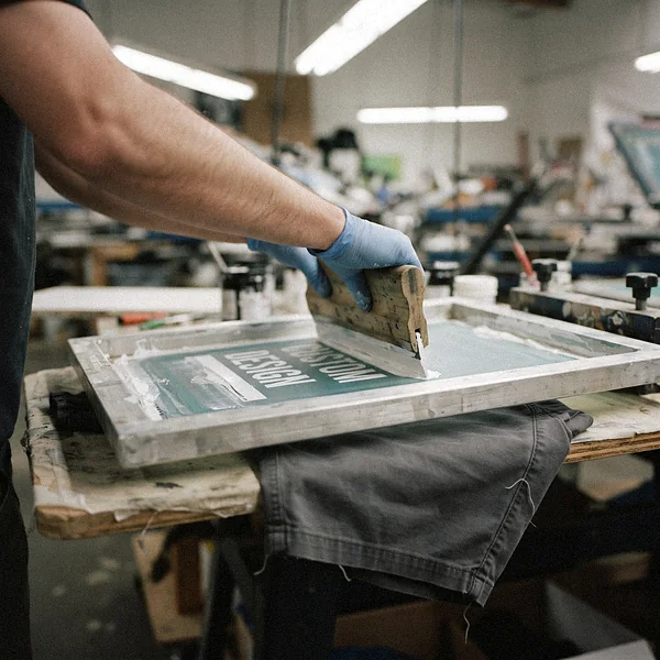 Screen printing CUSTOM DESIGN onto cotton shorts with a squeegee