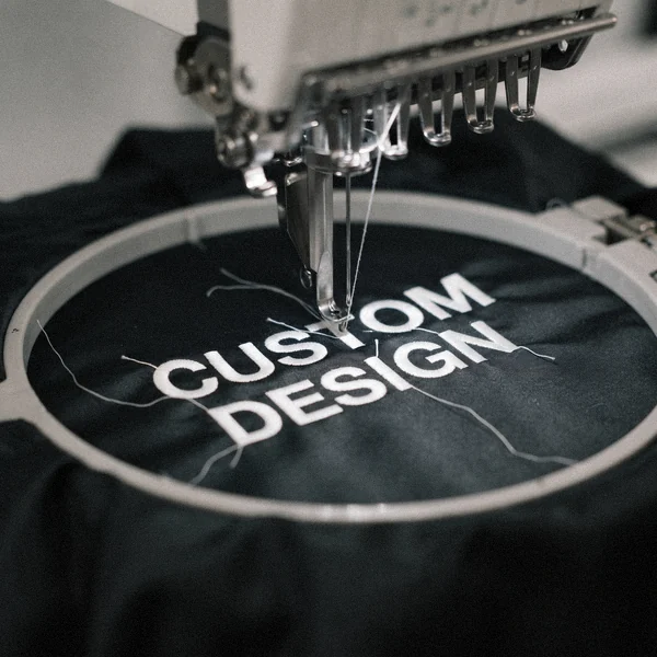 Embroidery machine stitching CUSTOM DESIGN on a bomber jacket chest