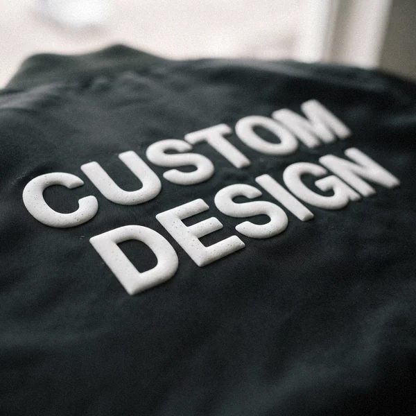 Raised puff print CUSTOM DESIGN text on a black bomber jacket