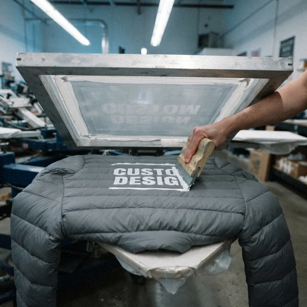 Screen printing CUSTOM DESIGN on the back of a nylon puffer jacket