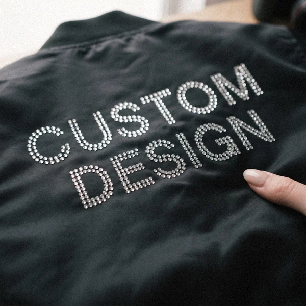 Rhinestone CUSTOM DESIGN lettering on a satin bomber jacket