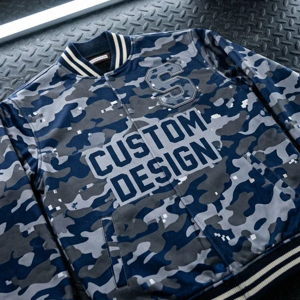All-over sublimated varsity jacket on a gym floor