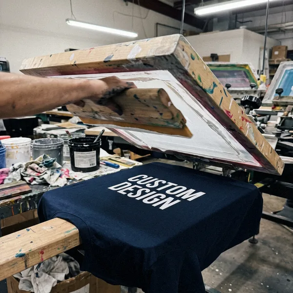 Screen printing CUSTOM DESIGN onto a T-shirt with a squeegee
