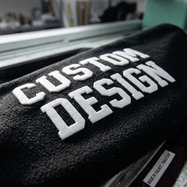 Puff print logo on a varsity jacket sleeve